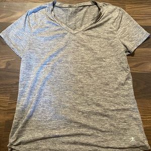 Gray women’s V-neck athletic top
